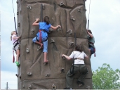 Kids Scaling the Rock